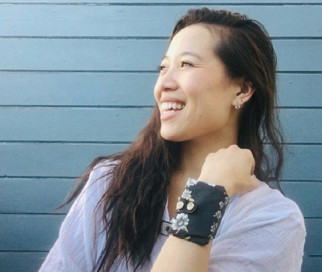 Smiling woman wearing floral wrist wallet