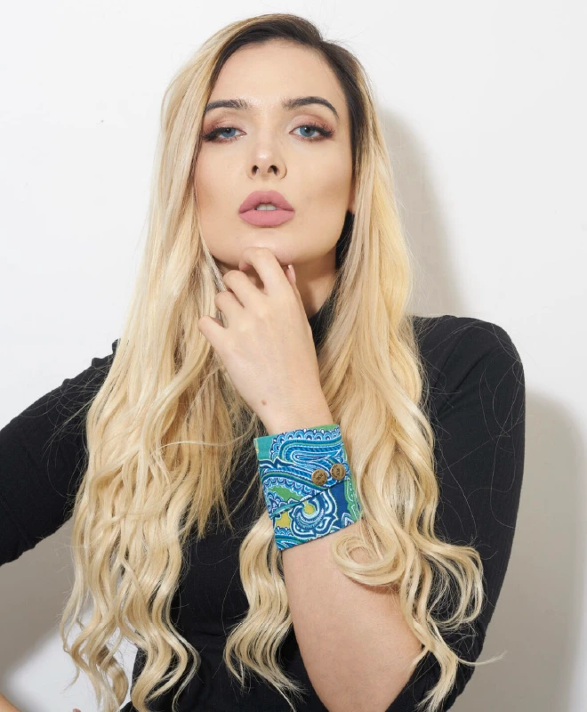 Woman wearing patterned wrist wallet